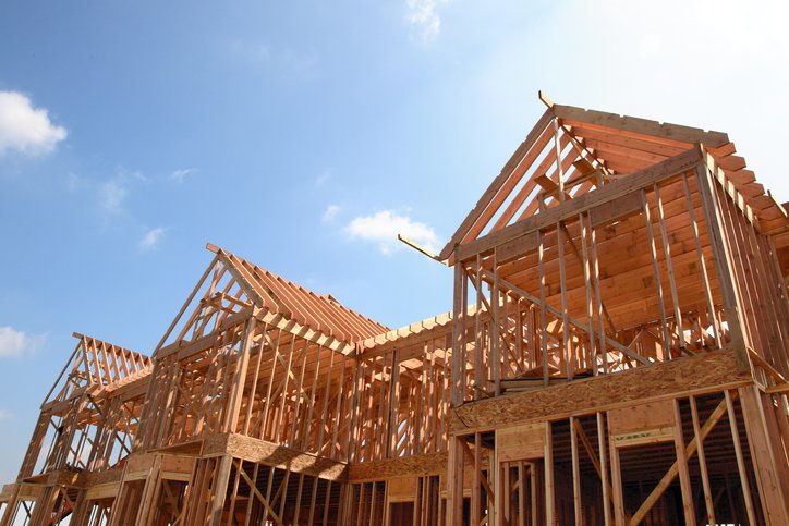 The wood skeleton of a house in the process of being built.